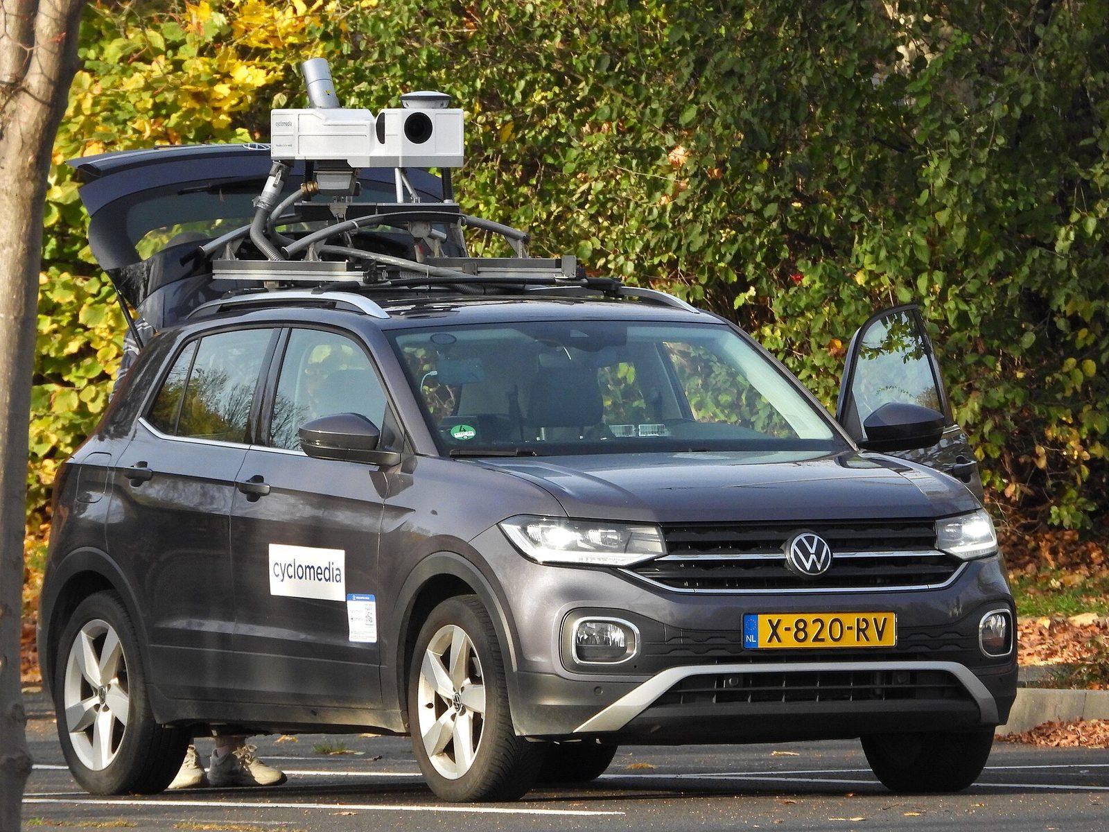 A Cyclomedia survey vehicle with a roof-mounted panoramic camera and LiDAR sensor assembly