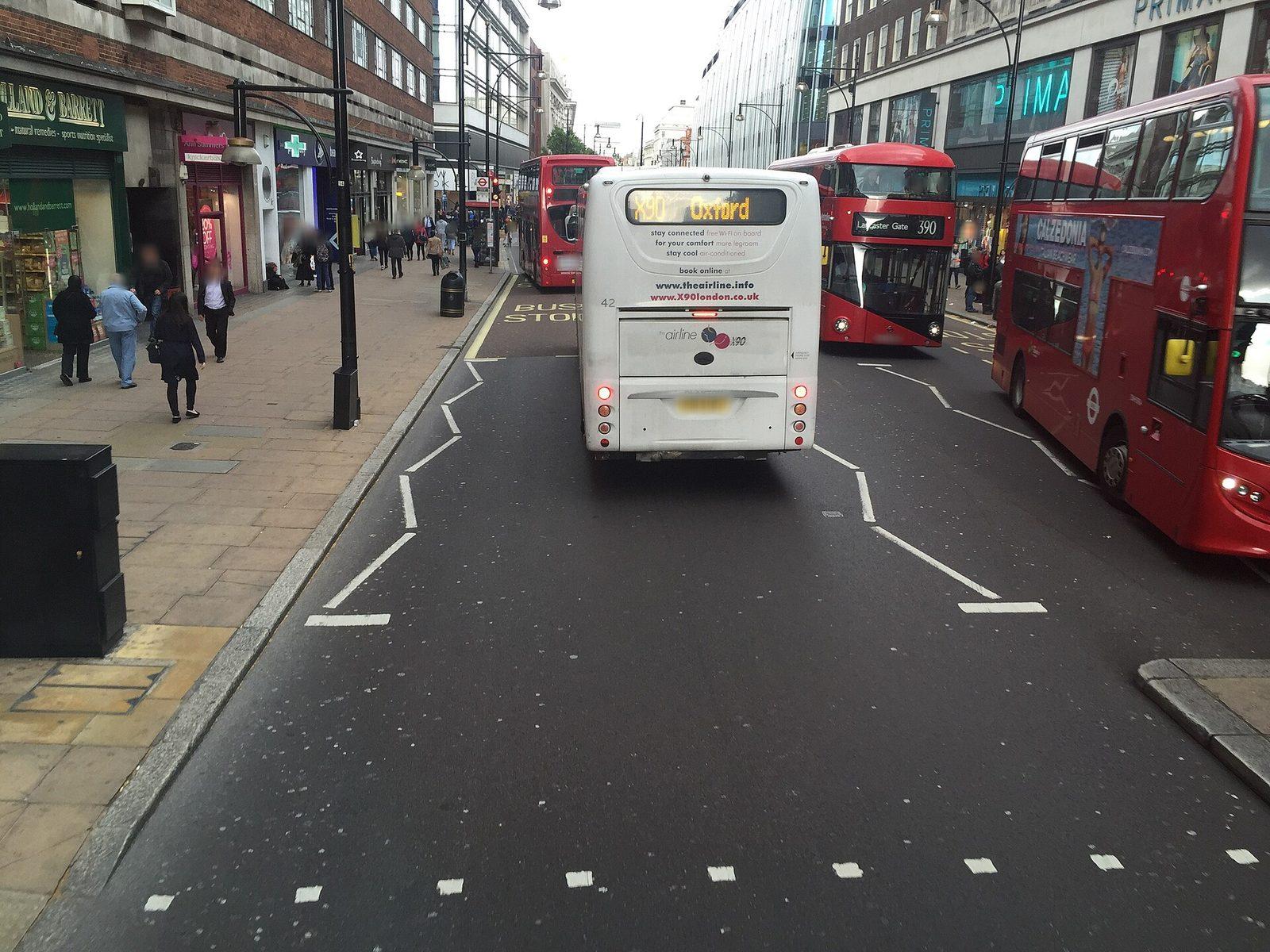 A single crowdsourced Mapillary street-level frame showing a road, pavement and buildings from a vehicle-mounted camera